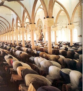 Muslims praying the Salat together, but it can be done alone, or even in the street.